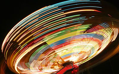 Time-lapse image of a midway ride looks like a spinning top.